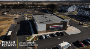 Aerial view of a CVS Pharmacy under construction at Prickett Preserve, surrounded by parking lots and nearby buildings. Text on the image reads "CVS Site Progress, December 12th, 2023.