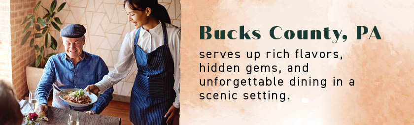 A server brings food to a smiling man, highlighting the best restaurants in Bucks County, PA.