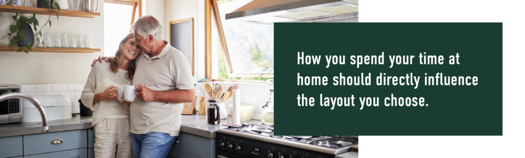 Older couple smiling in a kitchen, quoting how the right floorplan can shape time spent at home.