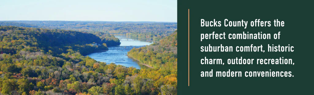 A wide river winds through autumn woods in Bucks County, ranked among the best places to live under a clear blue sky.