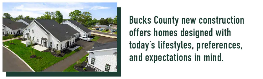 Aerial view of white homes in a new construction community for Bucks County homebuyers.